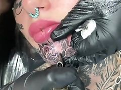Australian Bombshell Amber Luke Gets A Fresh Chin Tattoo